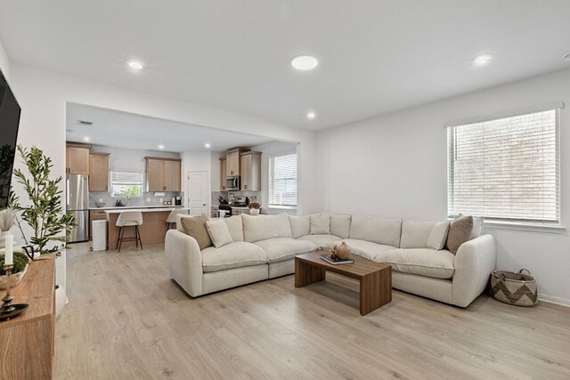 615 Backstays Loop, Kyle, TX 78640 - living area featuring light wood finished floors and recessed lighting