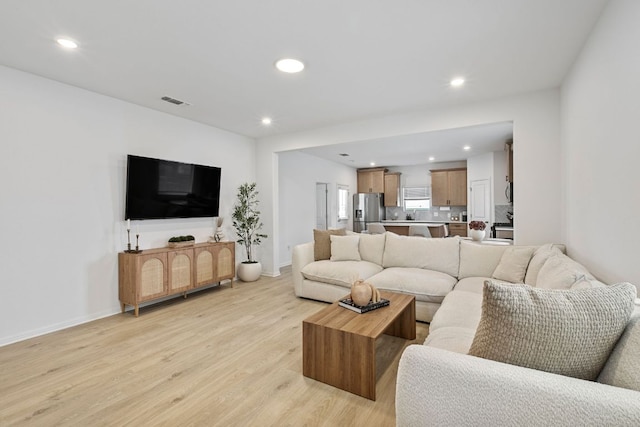 615 Backstays Loop, Kyle, TX 78640 - living room featuring light wood-style flooring, recessed lighting, and baseboards