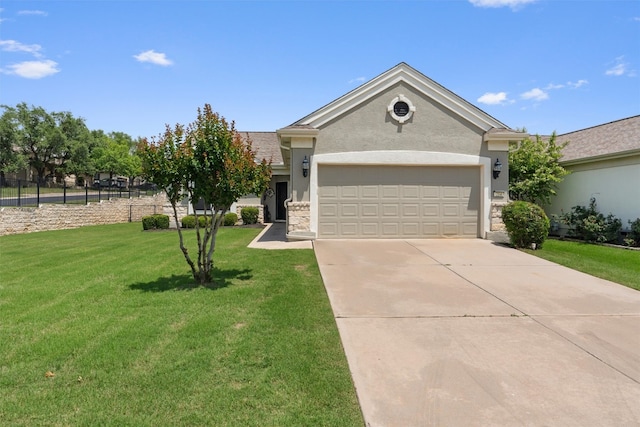 214 Fieldstone Dr, Georgetown, TX 78633 - view of front of house featuring stone siding, a front lawn, stucco siding, concrete driveway, and an attached garage