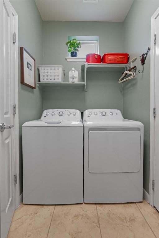 214 Fieldstone Dr, Georgetown, TX 78633 - clothes washing area with independent washer and dryer