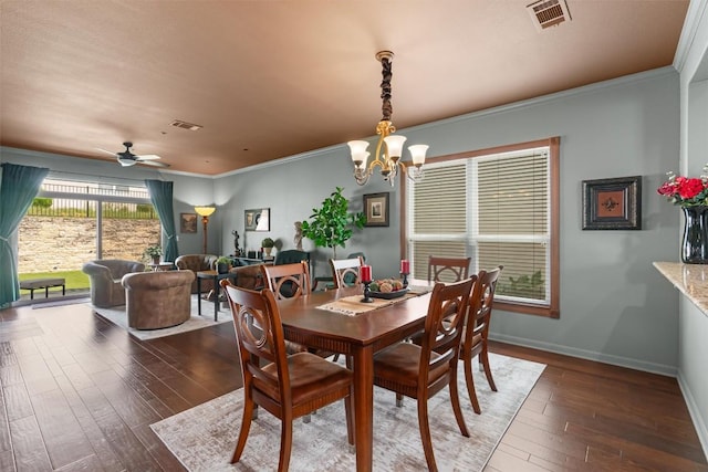 214 Fieldstone Dr, Georgetown, TX 78633 - dining space with hardwood / wood-style flooring, a chandelier, baseboards, crown molding, and ceiling fan