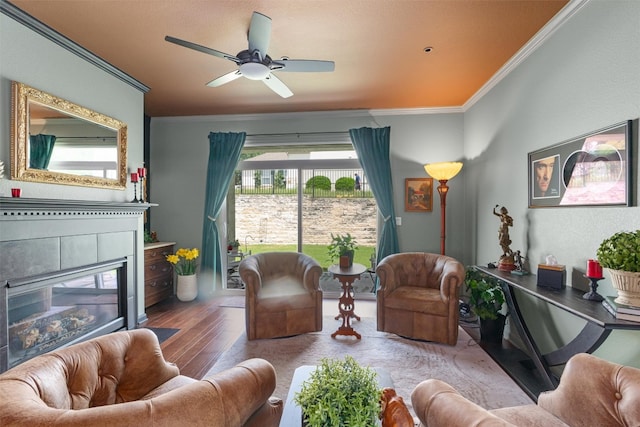 214 Fieldstone Dr, Georgetown, TX 78633 - living area featuring ornamental molding, a fireplace, wood finished floors, and ceiling fan
