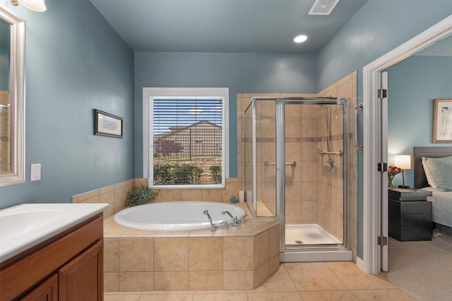 214 Fieldstone Dr, Georgetown, TX 78633 - ensuite bathroom with a stall shower, a garden tub, tile patterned flooring, and vanity