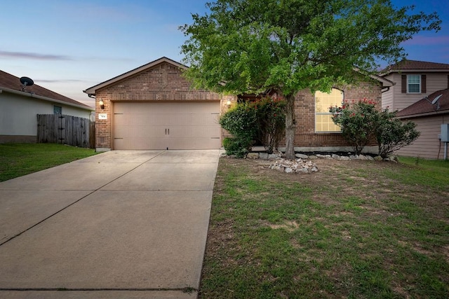 504 Sapphire Ln, Jarrell, TX 76537 - view of front of house featuring brick siding, concrete driveway, and an attached garage
