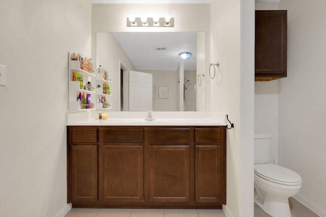 504 Sapphire Ln, Jarrell, TX 76537 - bathroom featuring toilet, baseboards, vanity, and tile patterned flooring