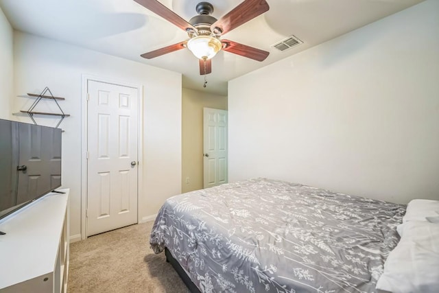 504 Sapphire Ln, Jarrell, TX 76537 - bedroom with light colored carpet, ceiling fan, and baseboards