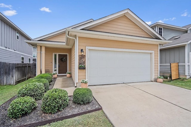 168 Pearl Way, Buda, TX 78610 - view of front of home featuring concrete driveway and an attached garage
