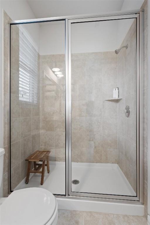 168 Pearl Way, Buda, TX 78610 - full bathroom with a shower stall and toilet