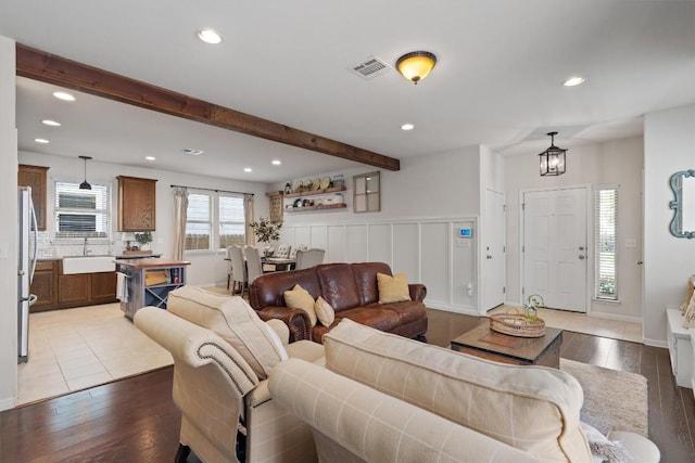 168 Pearl Way, Buda, TX 78610 - living room featuring recessed lighting, wood finished floors, beam ceiling, and a chandelier