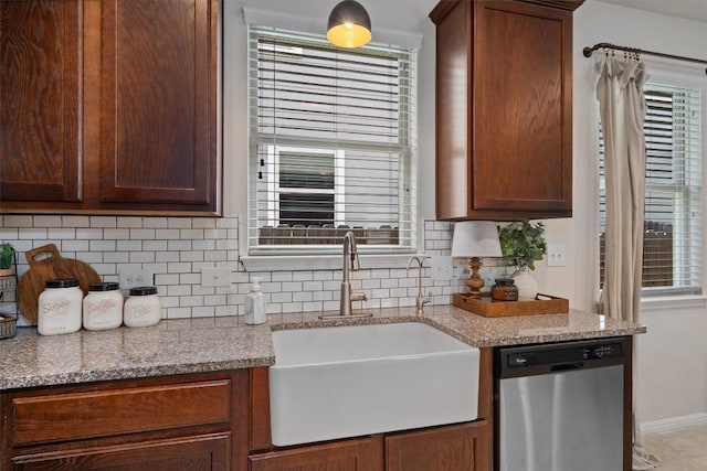 168 Pearl Way, Buda, TX 78610 - kitchen with stainless steel dishwasher, a sink, tasteful backsplash, and healthy amount of natural light