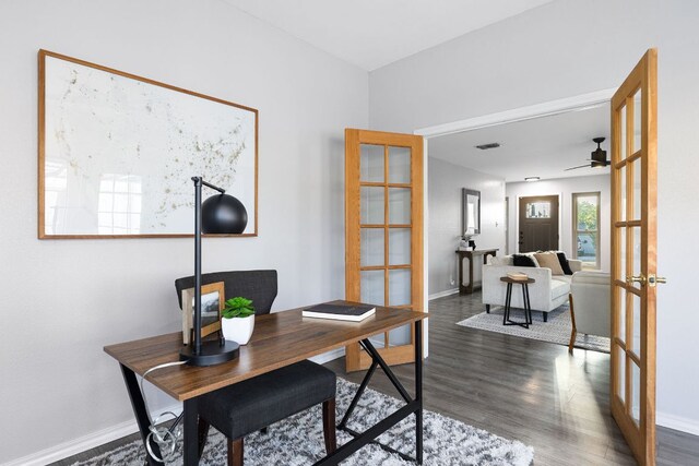 office space with french doors, dark wood-style flooring, ceiling fan, and baseboards