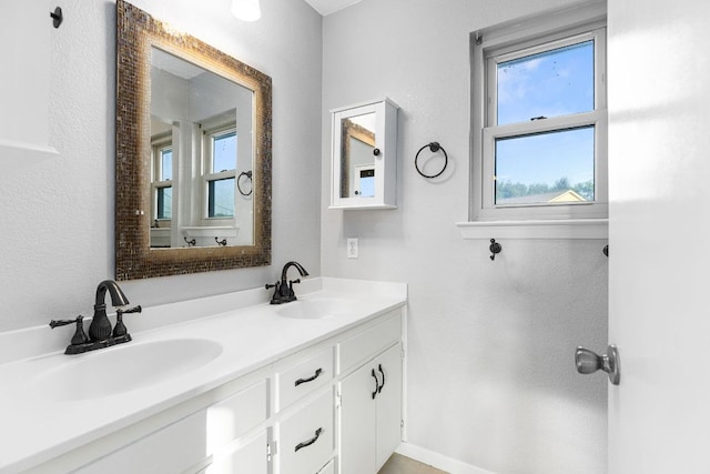 bathroom featuring double vanity