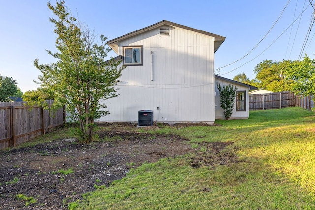 view of side of home featuring cooling unit