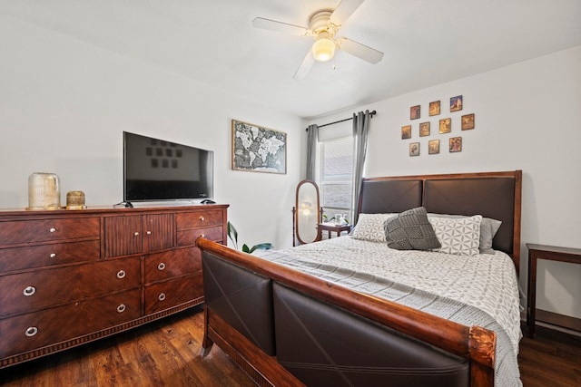 bedroom with dark wood-type flooring and a ceiling fan