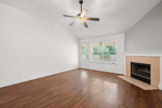 150 Primrose Blvd, Kyle, TX 78640 - unfurnished living room featuring lofted ceiling, a tiled fireplace, wood finished floors, and a ceiling fan