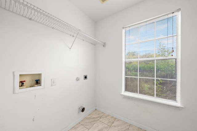 150 Primrose Blvd, Kyle, TX 78640 - washroom featuring electric dryer hookup, washer hookup, and light marble finish flooring