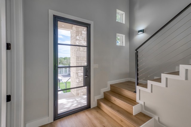 625 Desert Rose N, Horseshoe Bay, TX 78657 - stairway with wood finished floors and baseboards