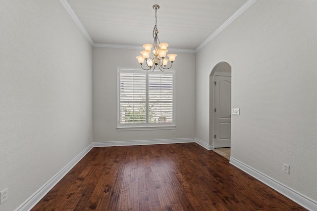 105 Longhorn Cavern Cv, Georgetown, TX 78633 - spare room with arched walkways, a chandelier, dark wood finished floors, ornamental molding, and baseboards