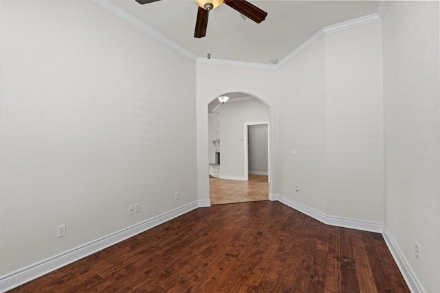 105 Longhorn Cavern Cv, Georgetown, TX 78633 - spare room with arched walkways, a ceiling fan, crown molding, wood finished floors, and baseboards