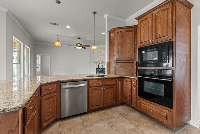 105 Longhorn Cavern Cv, Georgetown, TX 78633 - kitchen featuring black appliances, a sink, crown molding, light stone counters, and brown cabinetry