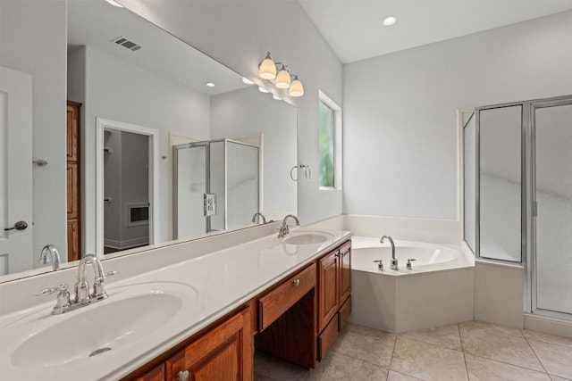 105 Longhorn Cavern Cv, Georgetown, TX 78633 - full bathroom with a stall shower, a bath, double vanity, and tile patterned flooring