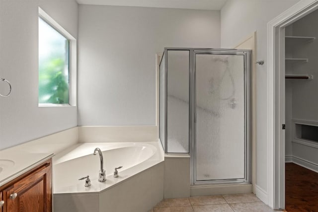 105 Longhorn Cavern Cv, Georgetown, TX 78633 - full bath with a stall shower, a bath, vanity, and tile patterned floors