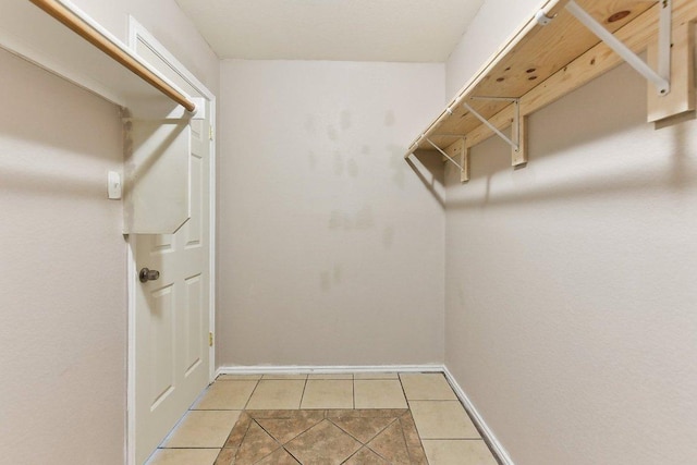 717 Blair Ave, Bastrop, TX 78602 - walk in closet featuring light tile patterned floors