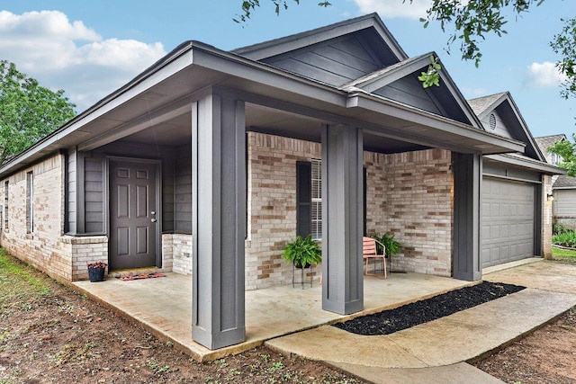 717 Blair Ave, Bastrop, TX 78602 - view of home's exterior featuring brick siding and a garage