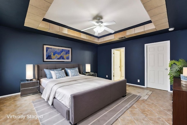 717 Blair Ave, Bastrop, TX 78602 - tiled bedroom with a raised ceiling, baseboards, and ceiling fan