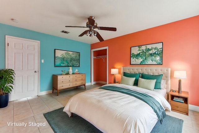 717 Blair Ave, Bastrop, TX 78602 - bedroom with light tile patterned flooring, a closet, ceiling fan, and baseboards