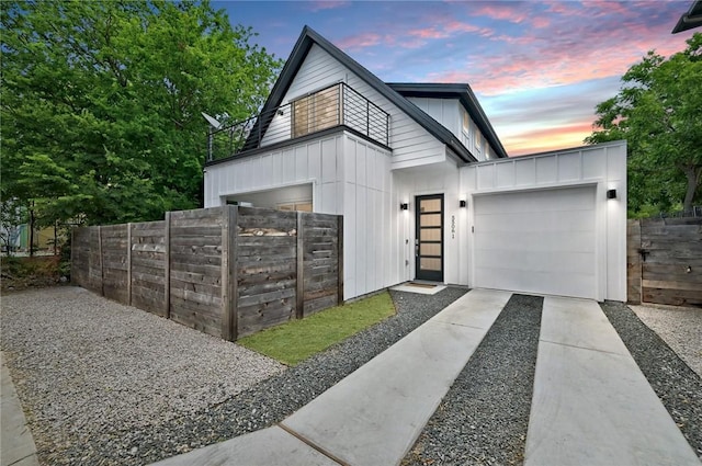 5506 Evans Ave Unit 1, Austin, TX 78751 - view of front of property featuring board and batten siding, driveway, and a garage