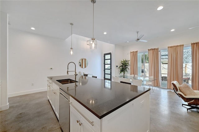 5506 Evans Ave Unit 1, Austin, TX 78751 - kitchen featuring dark countertops, recessed lighting, concrete floors, dishwasher, and a kitchen island with sink