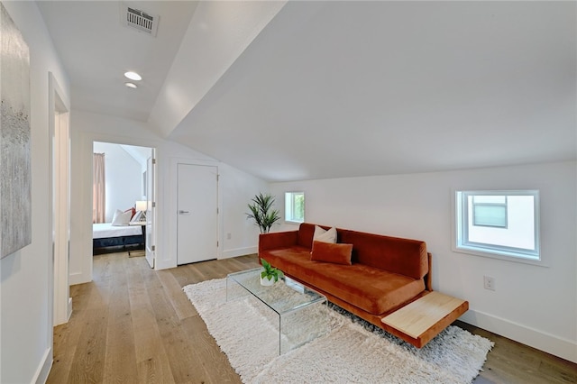 5506 Evans Ave Unit 1, Austin, TX 78751 - living area featuring light wood-type flooring, lofted ceiling, and recessed lighting
