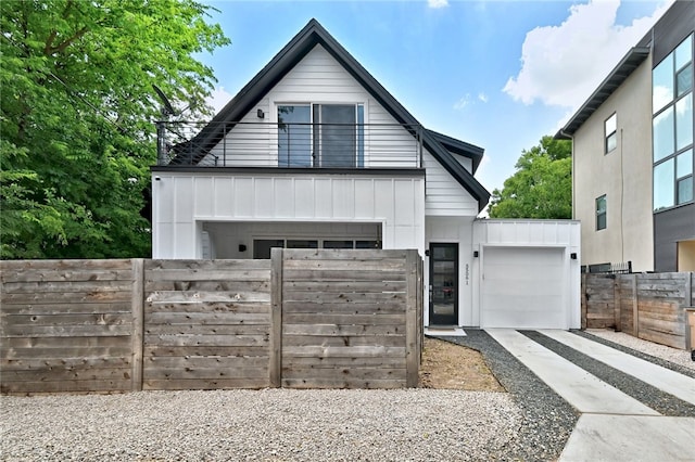 5506 Evans Ave Unit 1, Austin, TX 78751 - view of front facade with board and batten siding and driveway