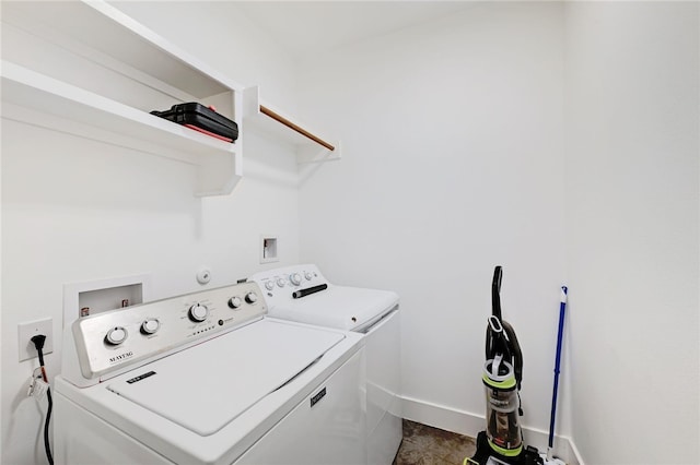 5506 Evans Ave Unit 1, Austin, TX 78751 - washroom with separate washer and dryer and dark tile patterned flooring