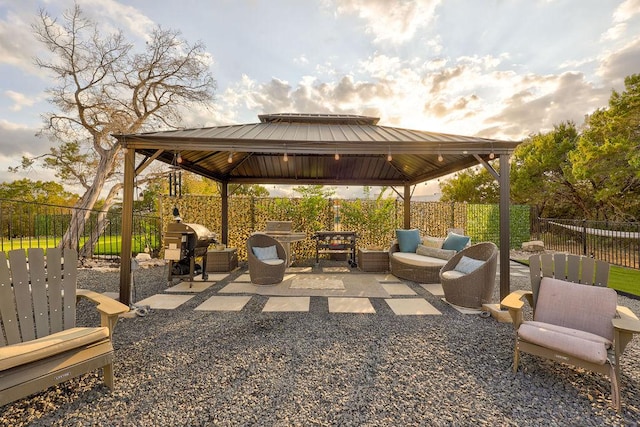 fenced backyard with a gazebo, a patio area, outdoor lounge area, and grilling area