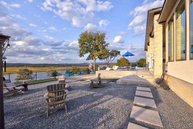 view of yard with fence and a water view