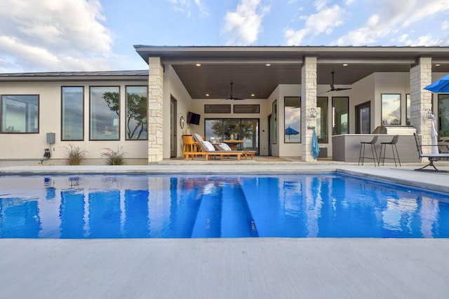 swimming pool featuring a ceiling fan and a patio