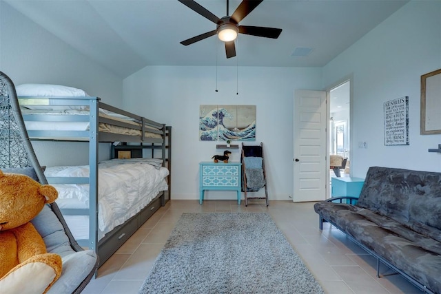 tiled bedroom with a ceiling fan