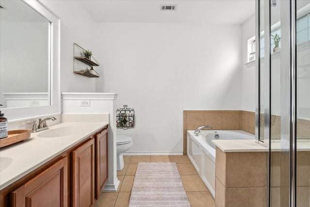 full bath featuring tile patterned flooring, a garden tub, toilet, double vanity, and a shower stall