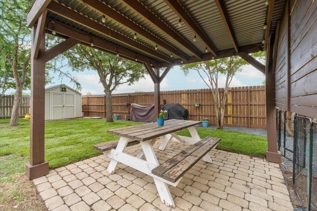 view of patio featuring a storage unit and an outbuilding