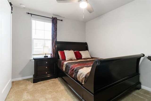 118 Ballyneal Ln, San Marcos, TX 78666 - bedroom with light colored carpet and ceiling fan