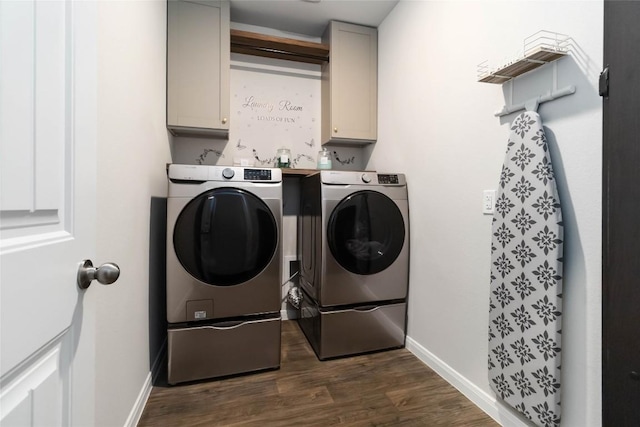 118 Ballyneal Ln, San Marcos, TX 78666 - washroom with cabinet space, washer and dryer, and dark wood-type flooring
