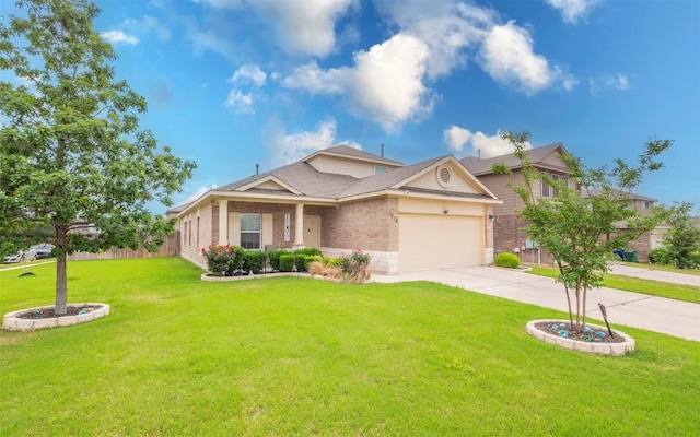1714 Deodara Dr, Cedar Park, TX 78613 - view of front of home with driveway, a front yard, an attached garage, and stone siding