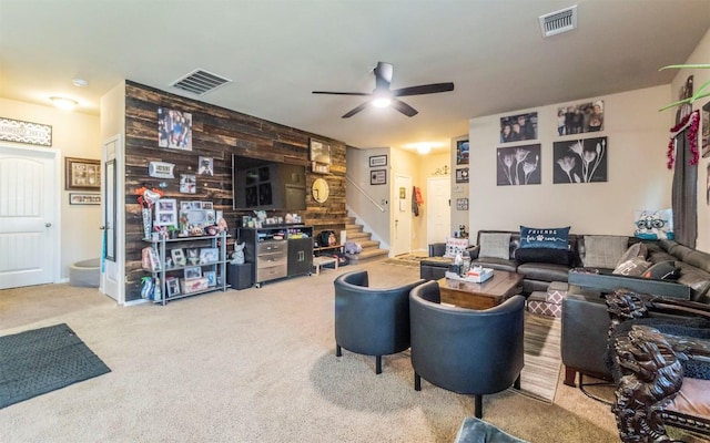 1714 Deodara Dr, Cedar Park, TX 78613 - carpeted living area featuring stairway, a ceiling fan, and wooden walls