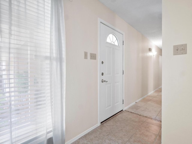 3513 Westchester Ave, Austin, TX 78759 - foyer entrance featuring baseboards and light tile patterned floors