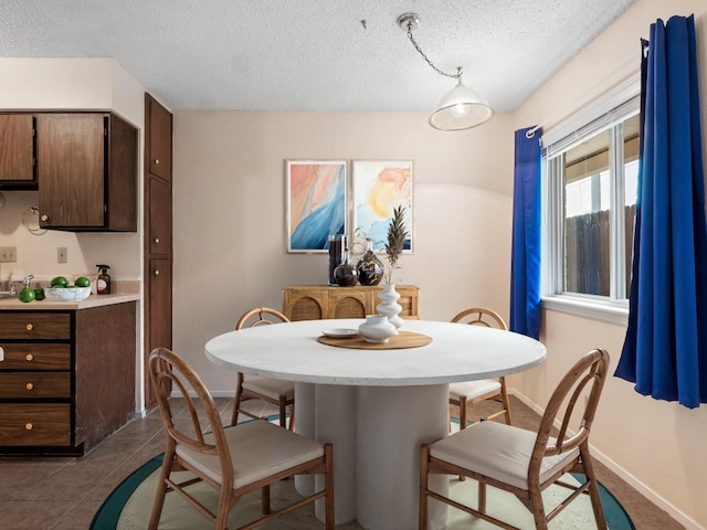 3513 Westchester Ave, Austin, TX 78759 - dining area featuring a textured ceiling and baseboards