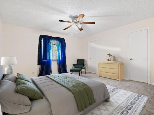 3513 Westchester Ave, Austin, TX 78759 - bedroom featuring a textured ceiling, a ceiling fan, and baseboards