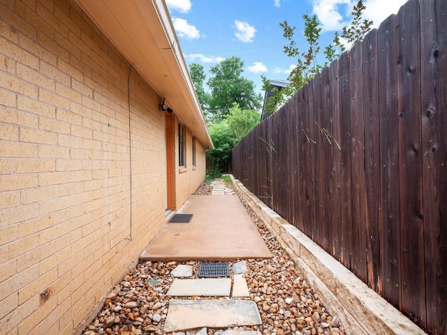3513 Westchester Ave, Austin, TX 78759 - view of home's exterior with brick siding and a patio area