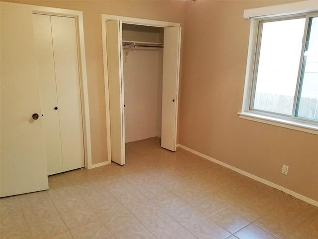 3513 Westchester Ave, Austin, TX 78759 - unfurnished bedroom featuring multiple closets and baseboards